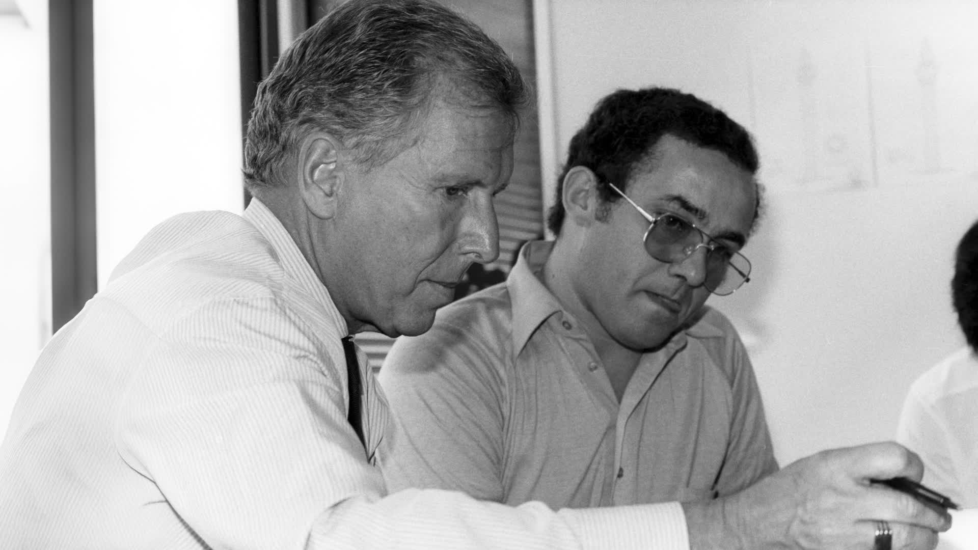 Arthur Erickson and a colleague examining their work together